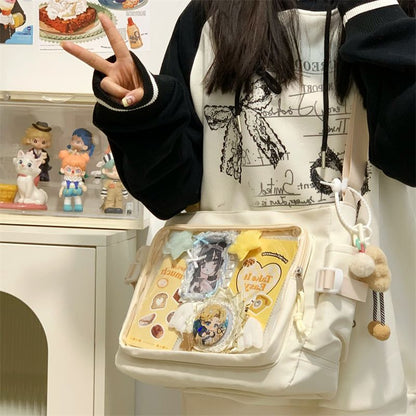 Cream ita messenger bag worn crossbody