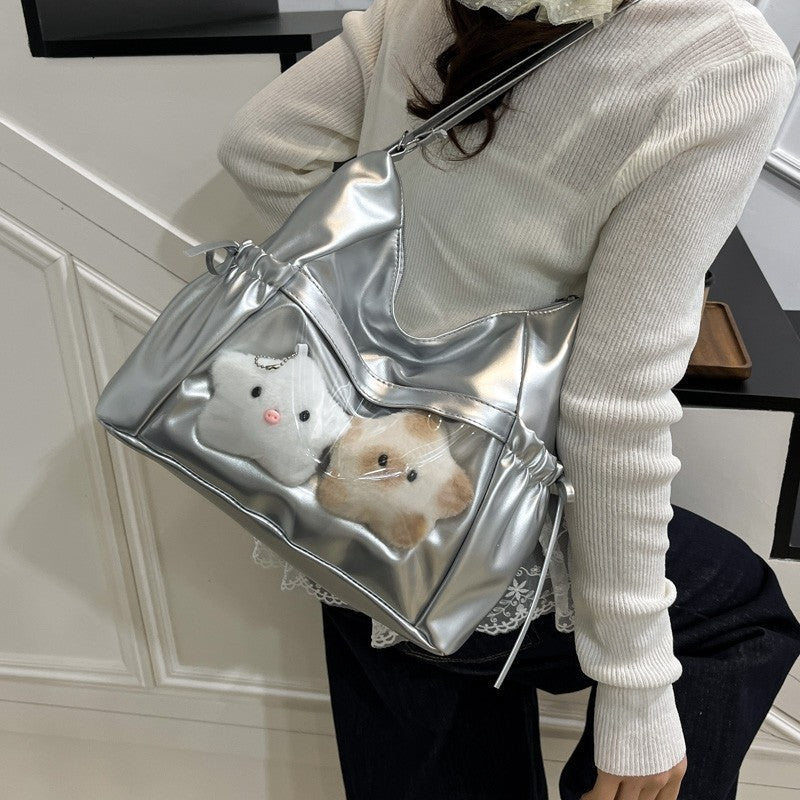 Silver ita hobo bag worn on the shoulder