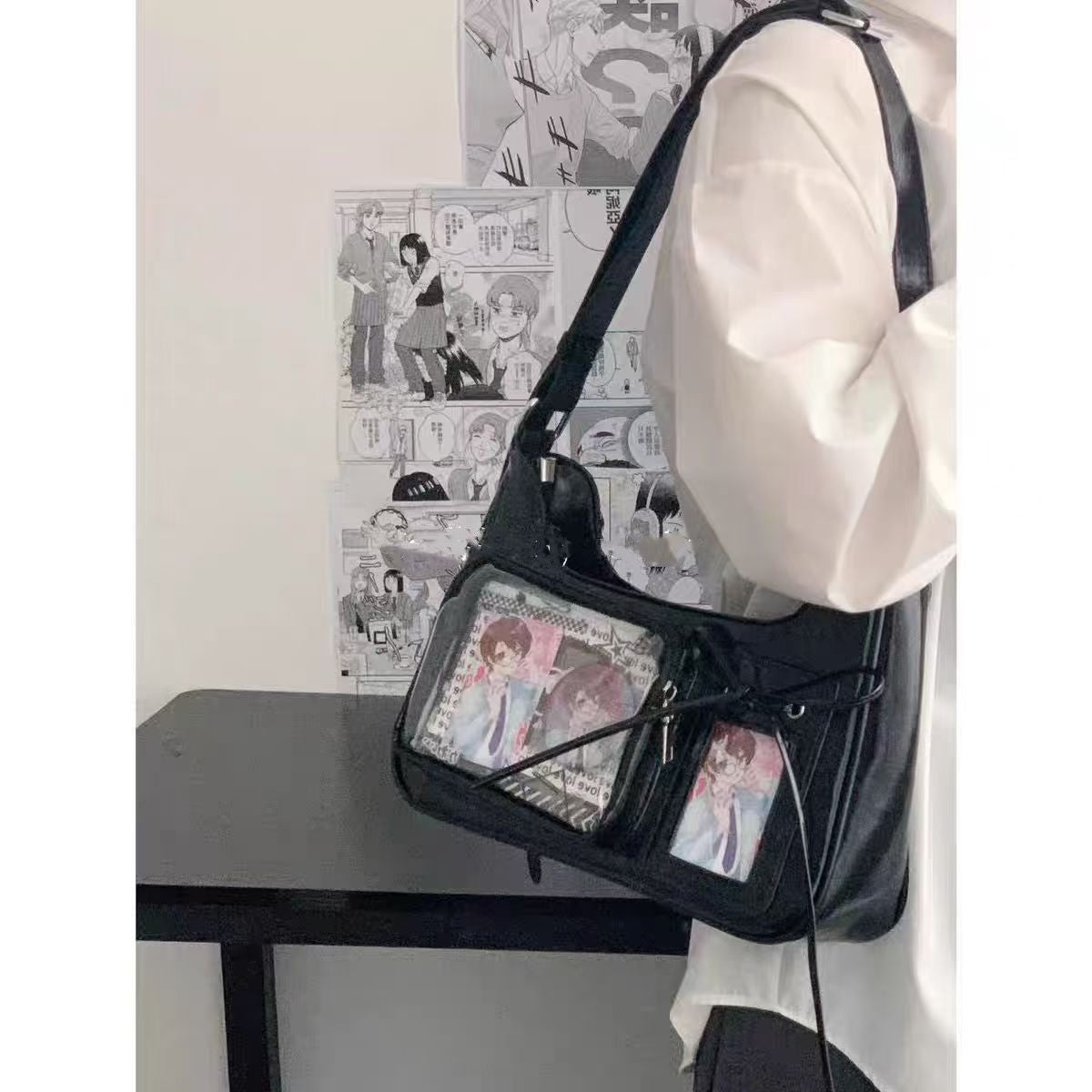 Black ita photocard underarm bag worn on the shoulder