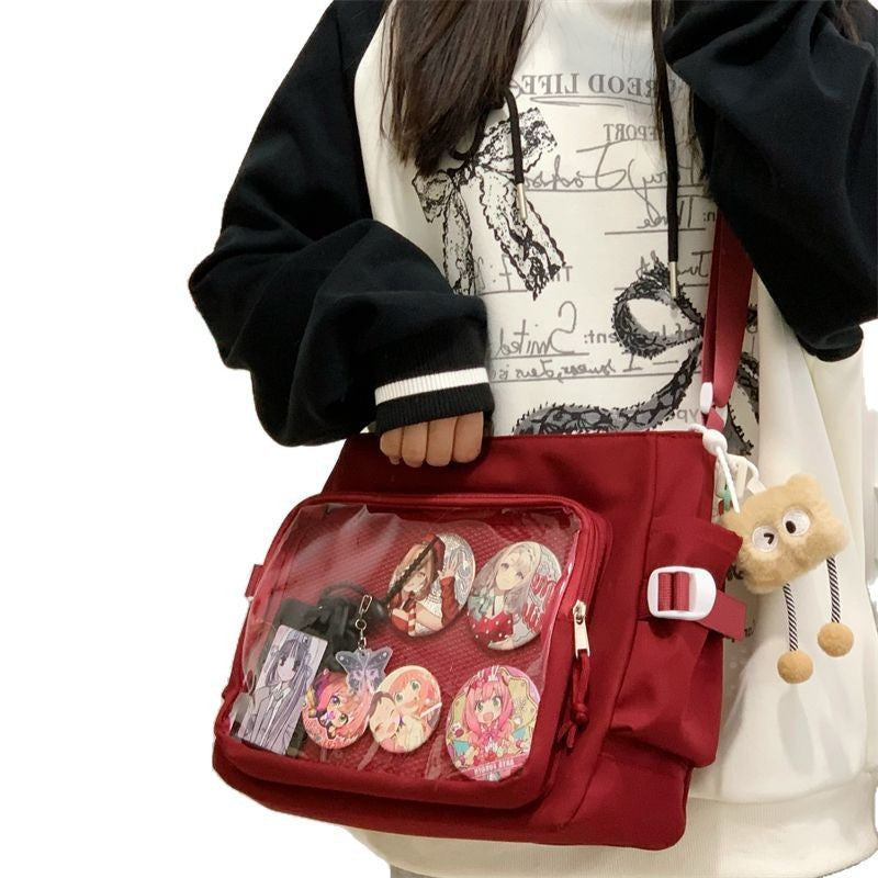 Red ita messenger bag with pin display window